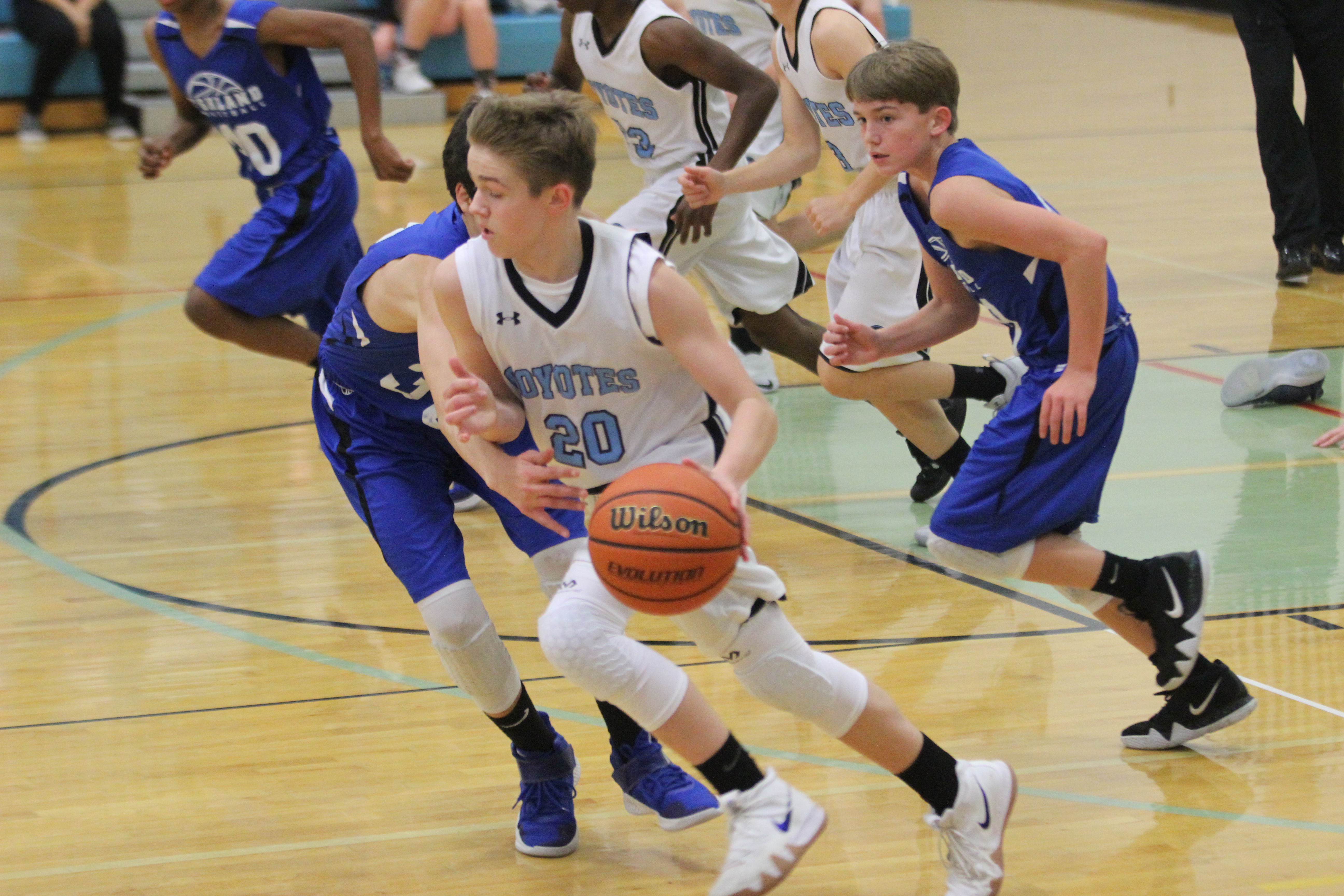 A student plays basketball.