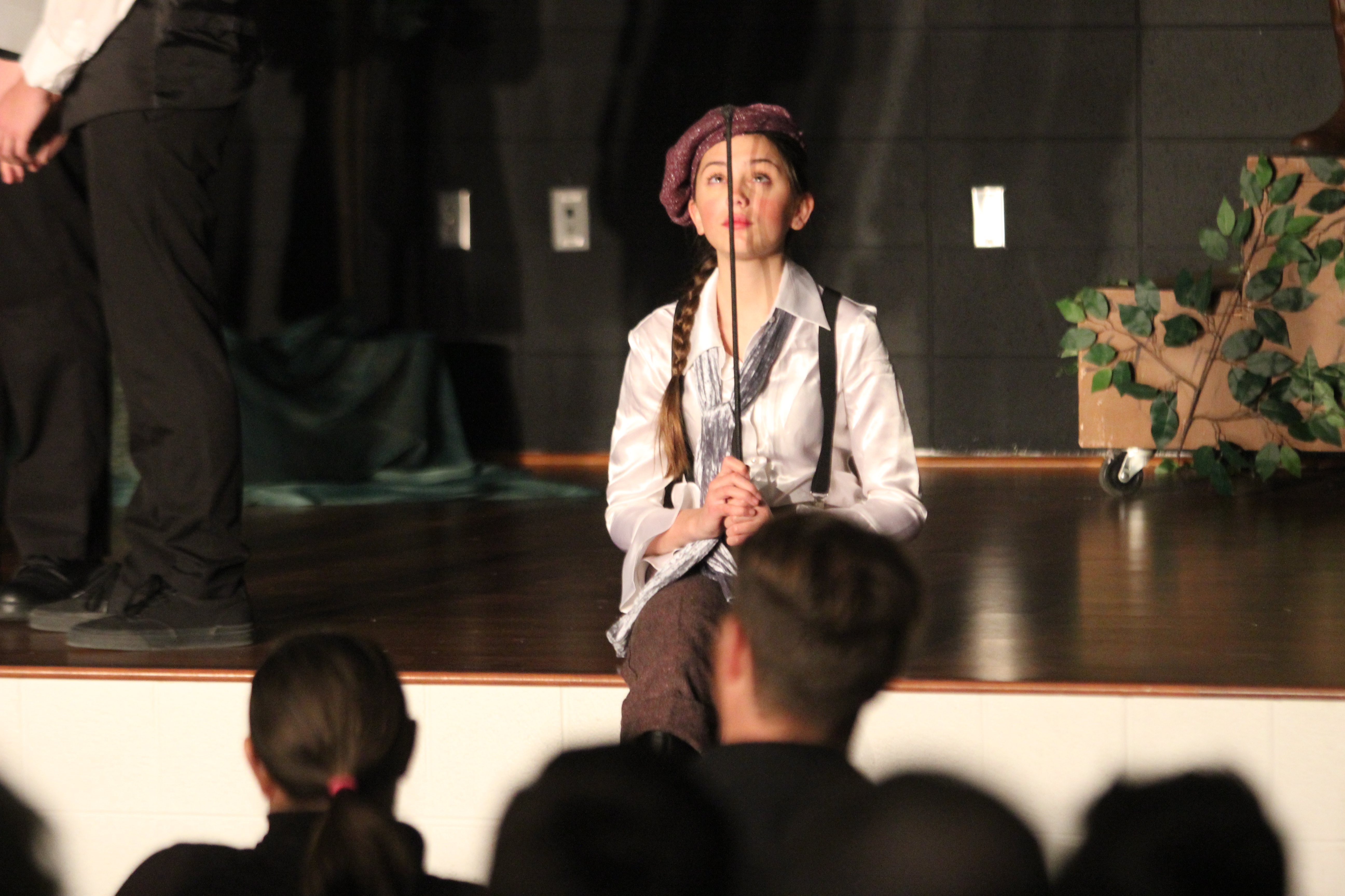 A student sits on the stage.