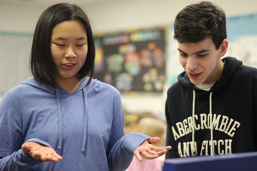 Two students present a project.