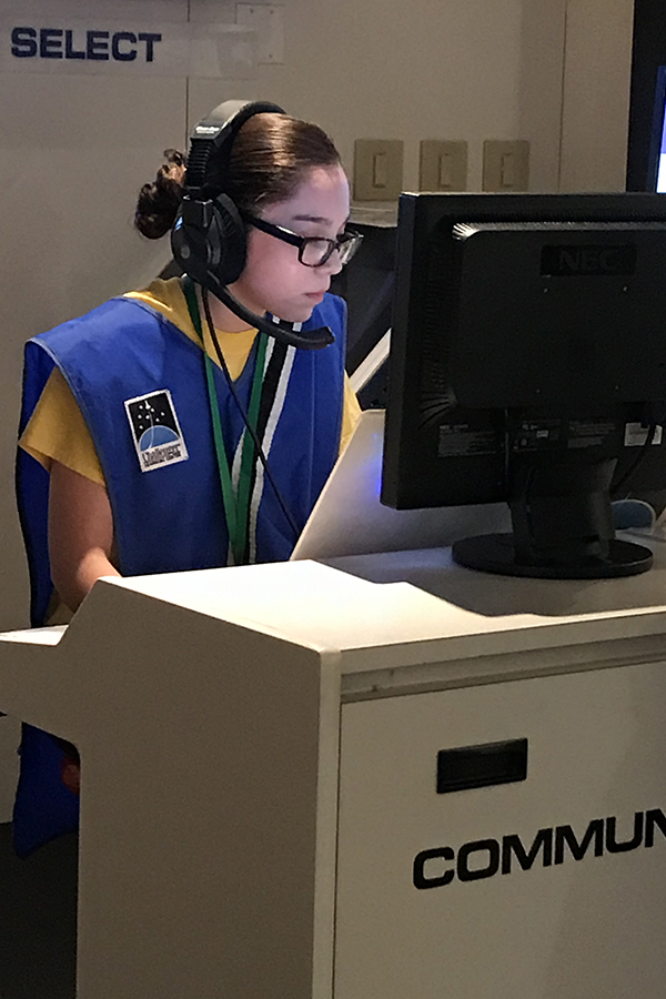 A student sits at a desk.