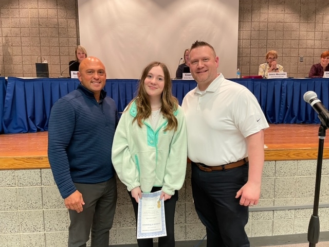 Mr. Alessia and Mr. Lewis congratulate Jillian Riordan for being selected for the All State Honor Band.