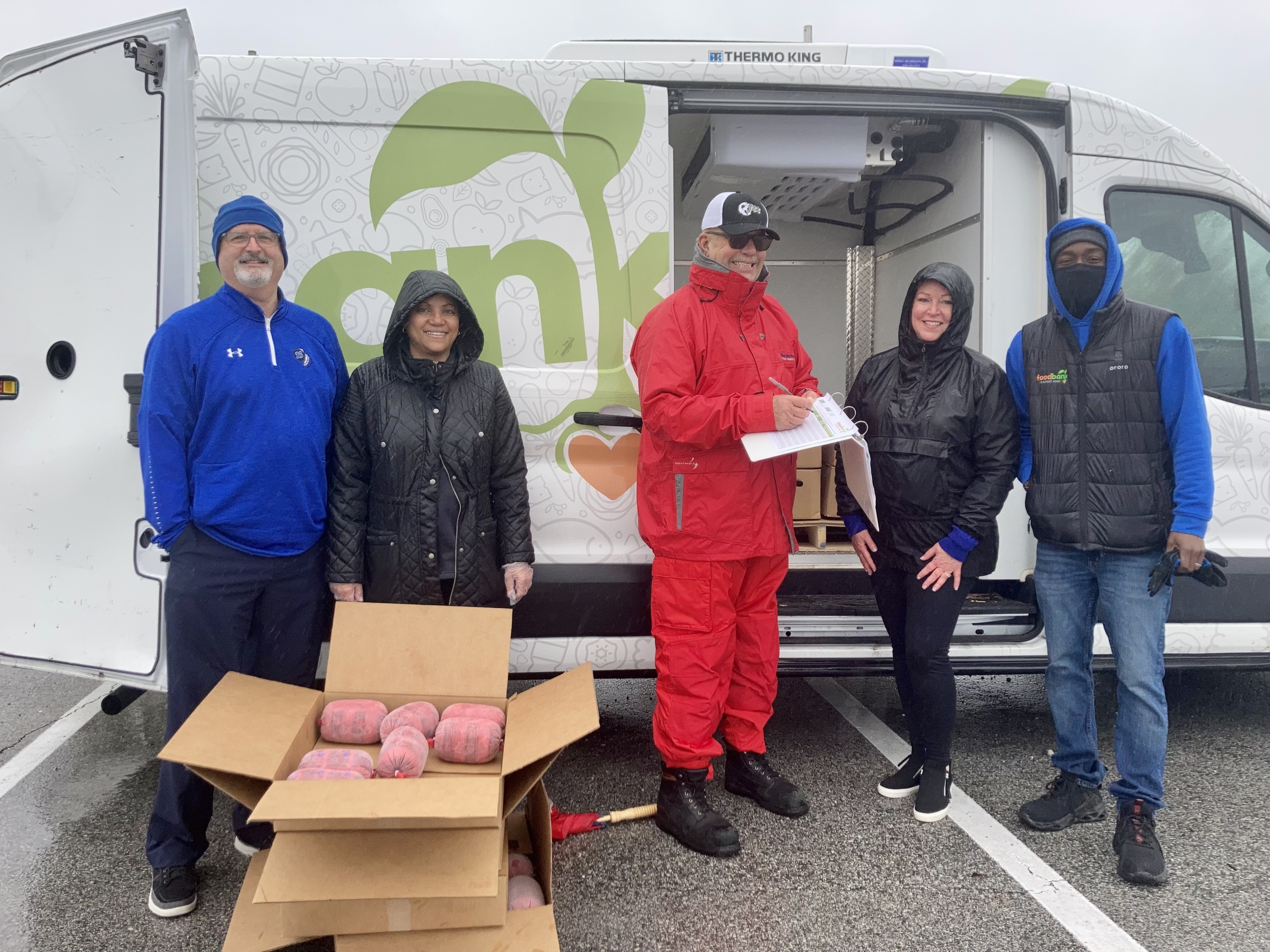 Central office staff and Mr. Mucha supported the efforts of the Food Bank of NWI in distributing food at LCHS on Friday, May 6.
