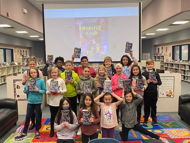These are Homan's Book Worms book club members! They are all so excited to read Monster Club by Darren Aronofsky and Ari Handel. They meet weekly with Mrs. Leonard, Homan's librarian.