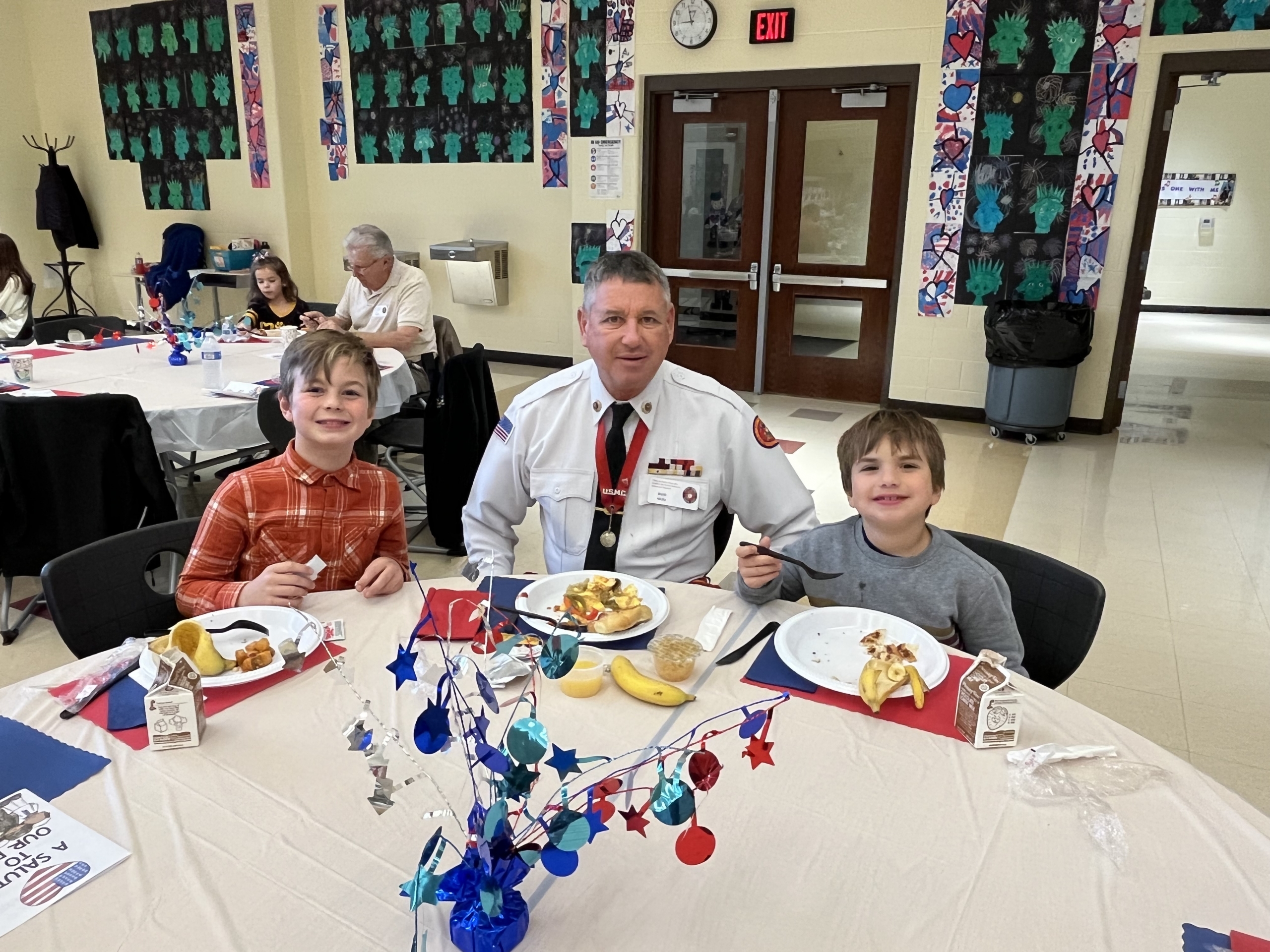 On Veterans Day, Mr. Hicks, a Marine veteran, enjoyed breakfast with his grandsons, Dean and Daniel Perez.