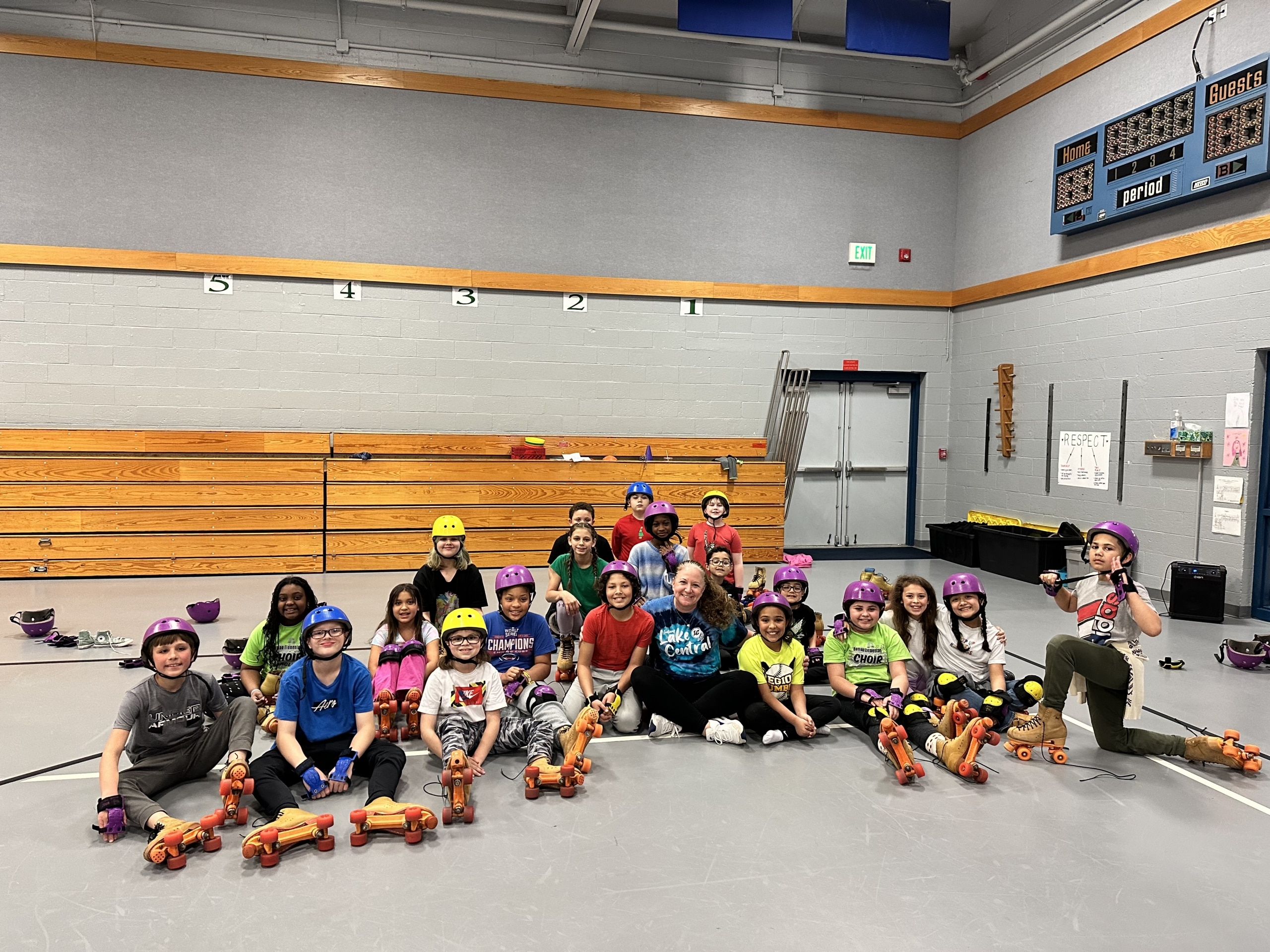 Mrs. Schultz, Homan Elementary, celebrates her Teacher of the Year award with her roller derby team on Friday, April 19, 2024.