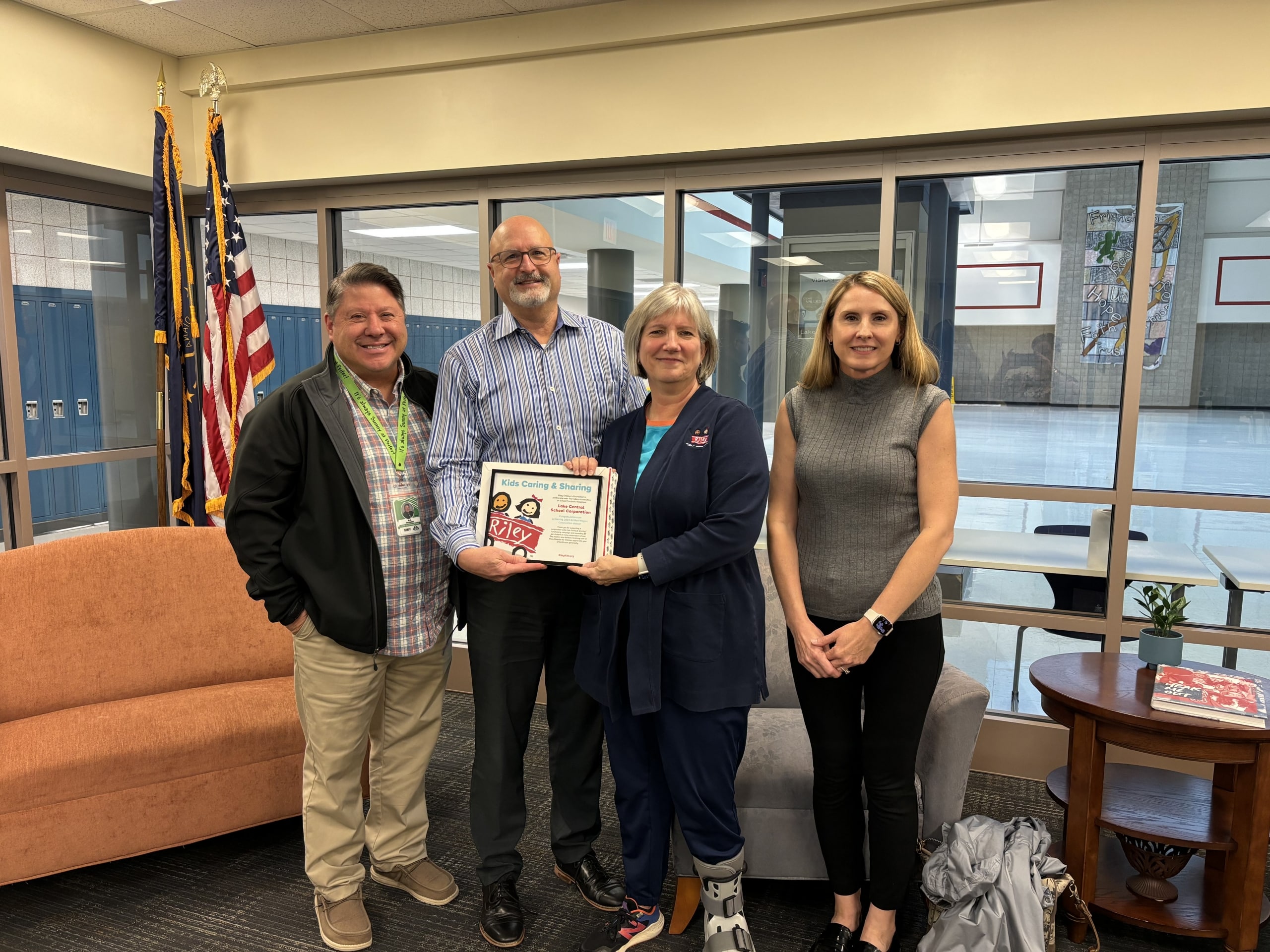 Mr. Delaughter, Dr. Veracco, and Mrs. Castaneda happily accepted the Riley Children’s Hospital Red Wagon Award from Susan Miles on October 22, 2024.