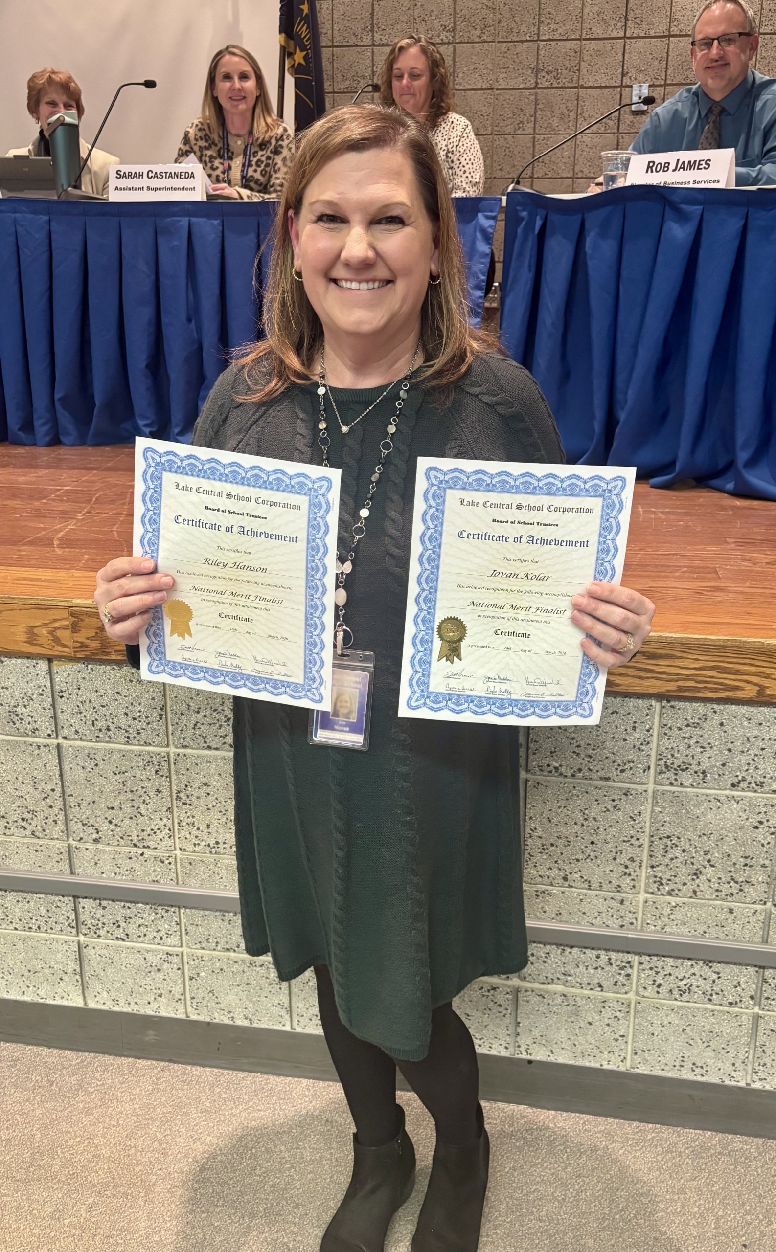 LCHS Principal Erin Novak proudly displays Certificates of Achievement for our two National Merit Finalists. Students RILEY HANSON and JOVAN KOLAR scored in the top 1% of students nationwide. Congratulations!!