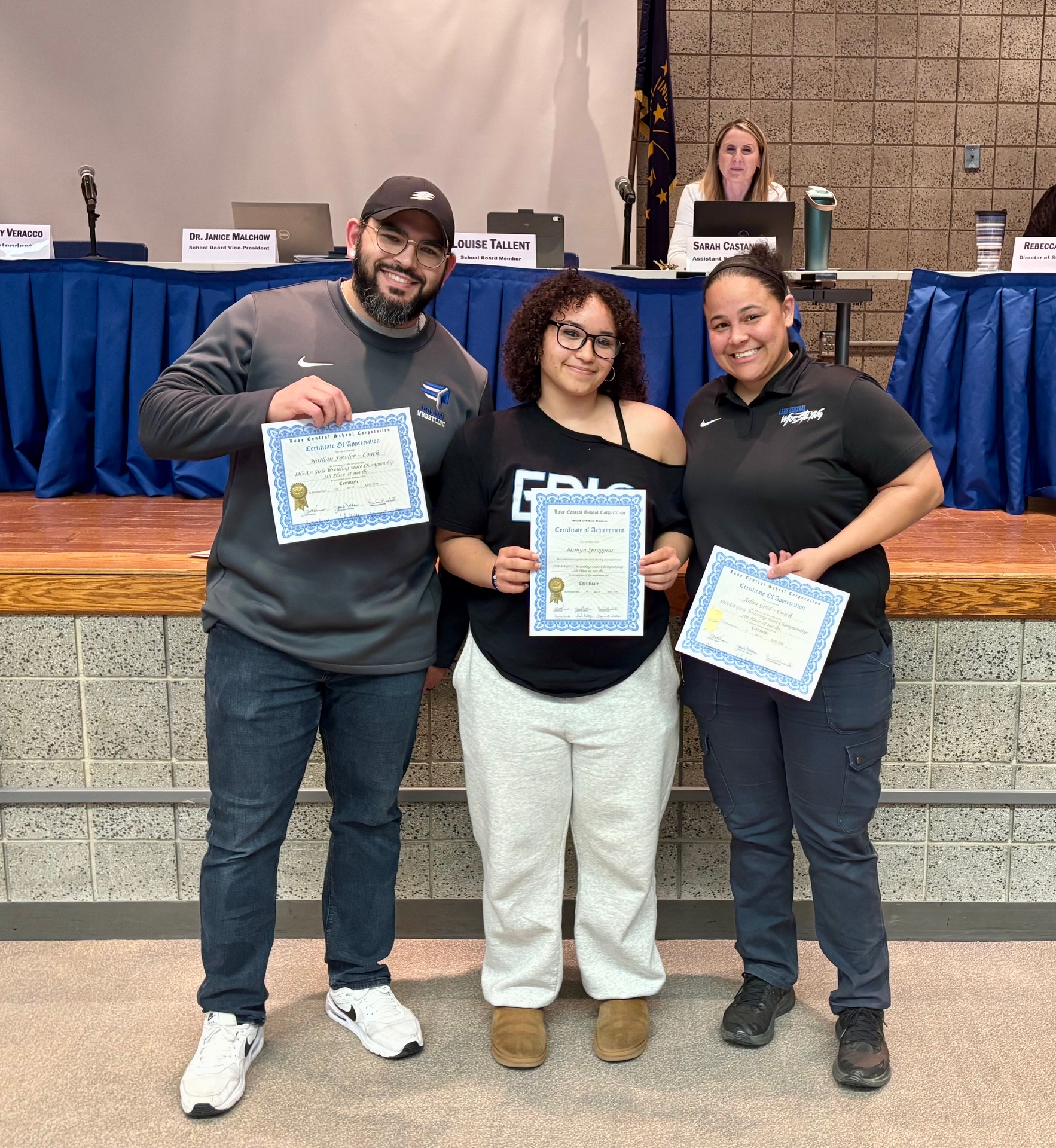 Jasmyn Spraggis being recognized by the School Board for her 7th Place IHSAA Girls Wrestling State Championship, along with Coach Fowler and Coach Gold